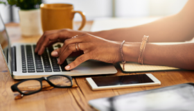 Woman typing on a computer