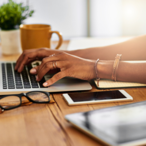 Woman typing on a computer