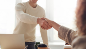 Two people shaking hands.