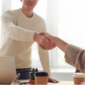 Two people shaking hands.